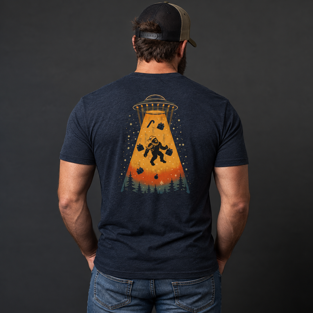 Merry Squatchmas Abduction T-shirt Heather Navy back design lifestyle creative