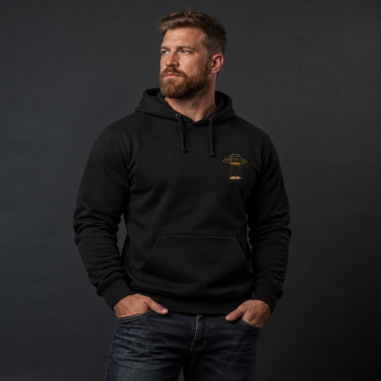 Merry Squatchmas Abduction Hoodie Black front logo lifestyle creative